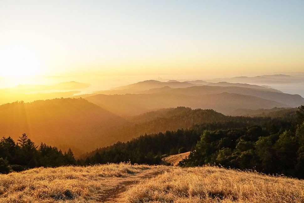 Sunset from Mount Tamalpais looking over forested ridges toward San Francisco