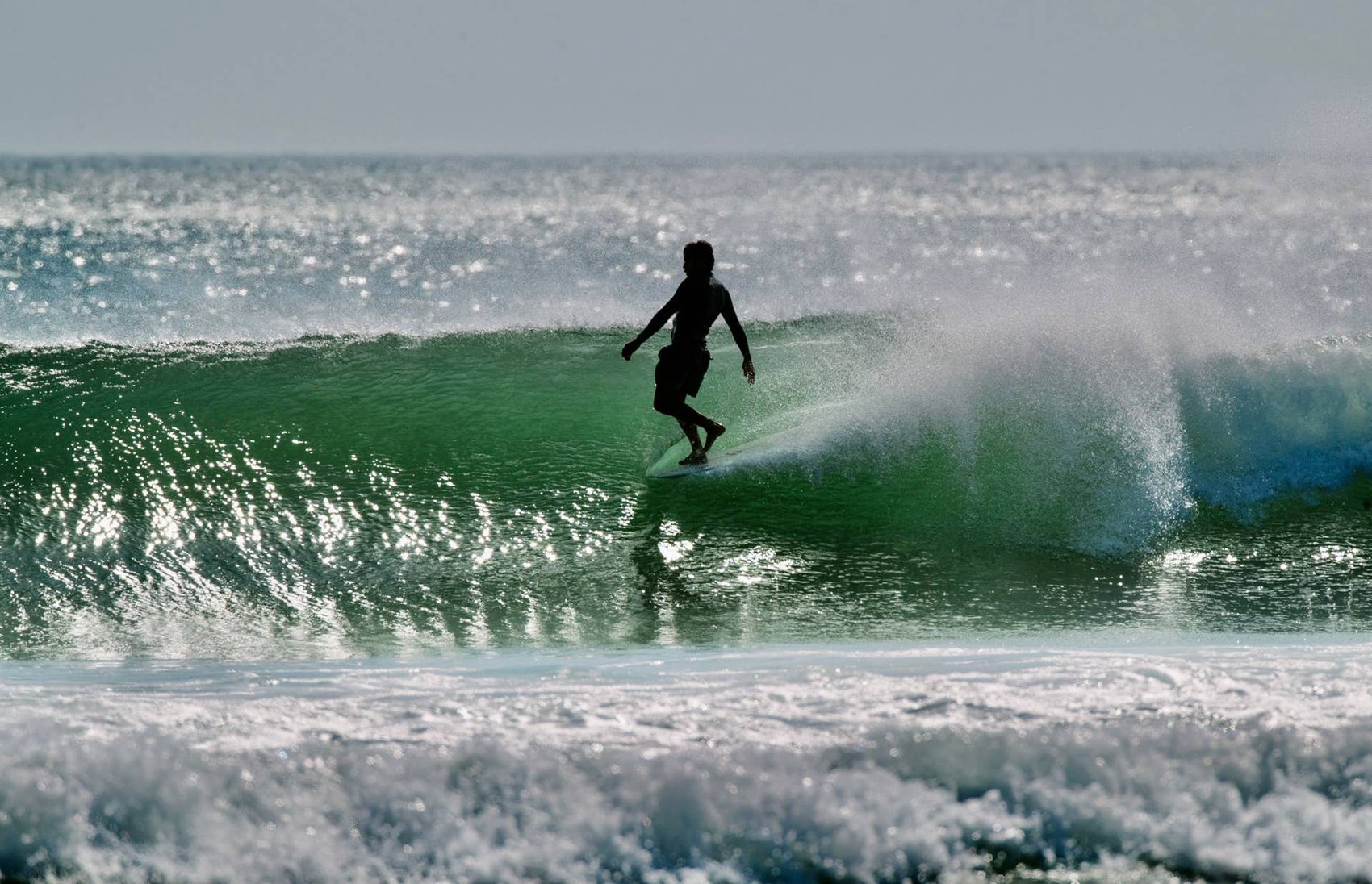 A surfer on a clean wave