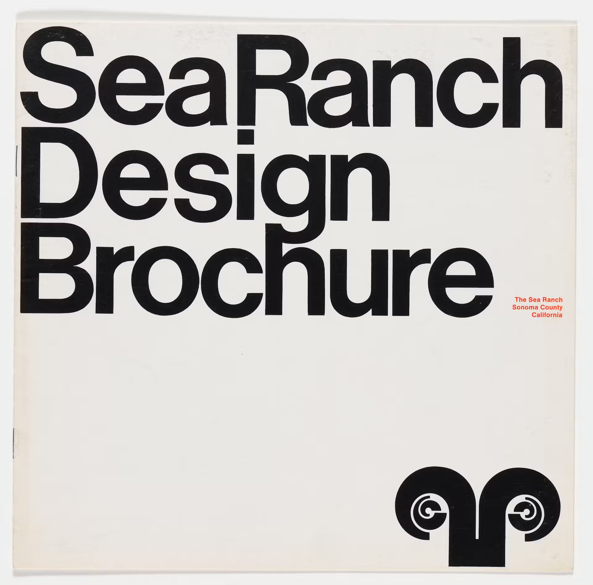 The cover of the Sea Ranch Design Brochure by Barbara Stauffacher Solomon, circa 1965, the title set large and tight in black Helvetica on white, with the ram's head logo below and The Sea Ranch, Sonoma County, California in small red type